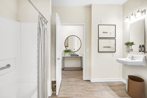 a bathroom with a shower and a sink