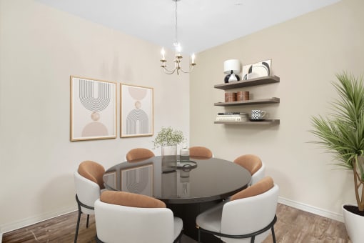 a dining room with a table and chairs