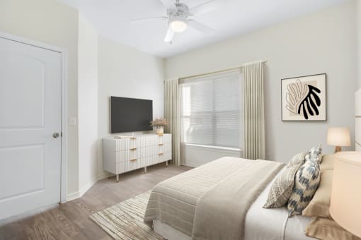 a bedroom with a large window