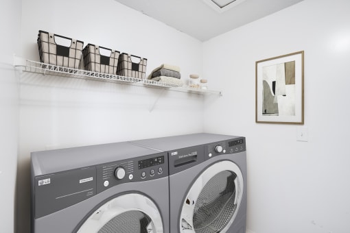 a laundry room with a washer and dryer