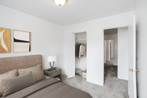 a bedroom with a bed and a nightstand