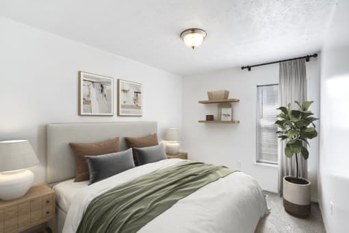 a bedroom with a large bed and a large window