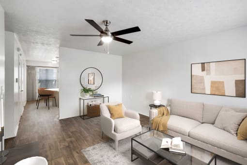 our apartments offer a living room with a couch a chair and a coffee table