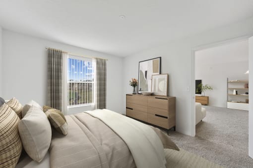 a bedroom with a large bed and a dresser