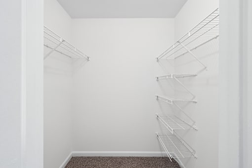 a closet with wire shelves