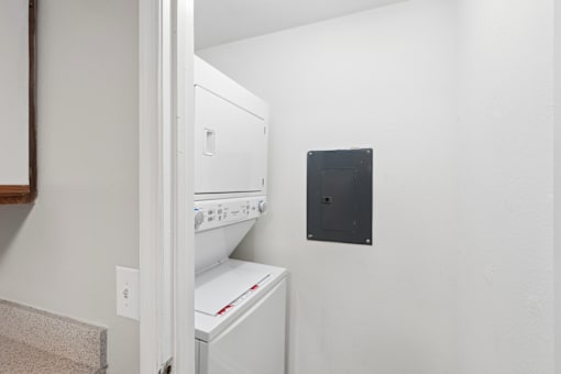 A white oven and dishwasher in a kitchen.