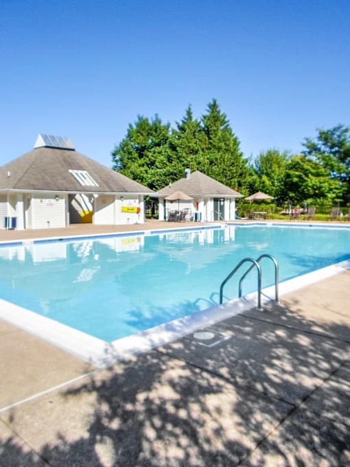 A swimming pool with a sun shining on it.