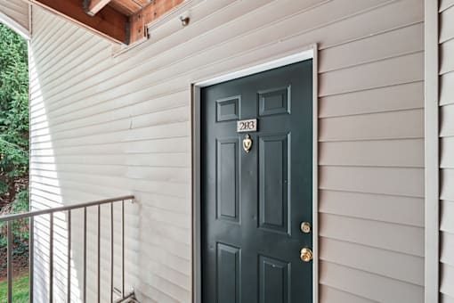 A black door with the number 283 on it.