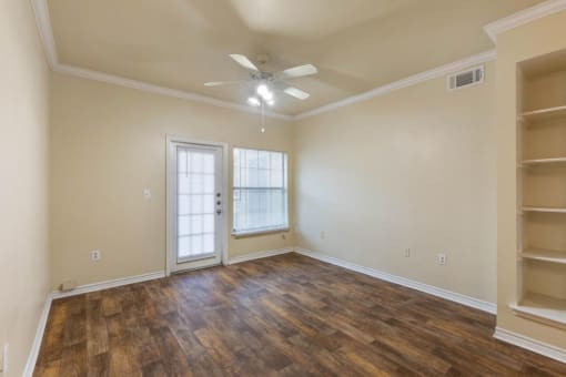 Living Room with Built-In Shelves and Hardwood Style Flooring