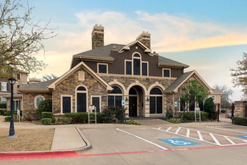 Clubhouse exterior with parking lot