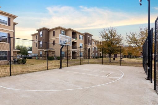 Basketball court and building exterior in background