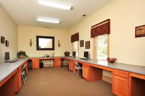 Computer lab with computers, desks, and chairs