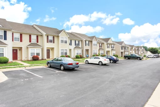 Building Exterior surrounded by shrubbery and front parking lot