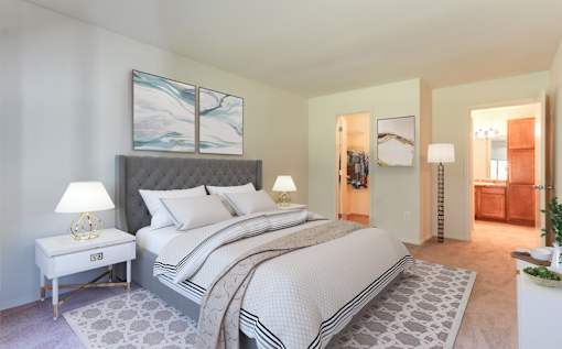 a bedroom with a bed and two night stands