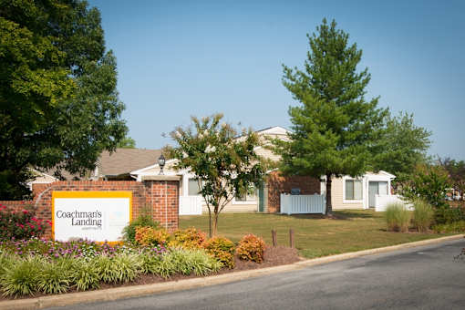 a sign in front of a house