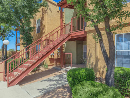 Apartment Building exterior with staircase leading to second story