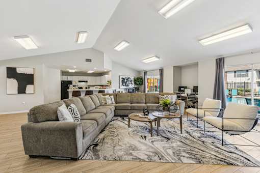A living room with a grey sofa and a coffee table.
