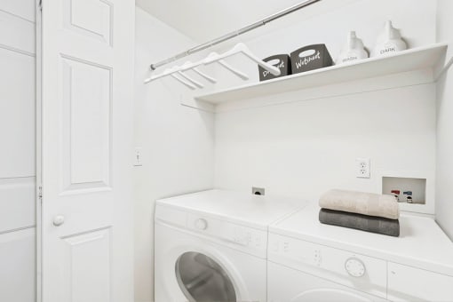 Laundry room with front loading washer and dryer at Rose Cove Homes Apartments, Farmington, UT