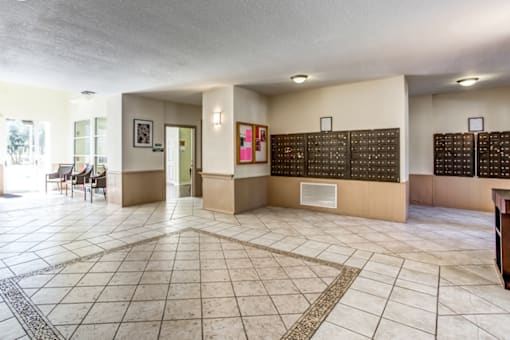 the lobby of a restaurant with tables and chairs