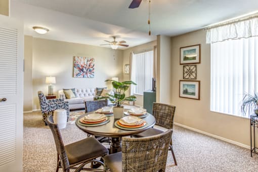 a dining room with a table and chairs