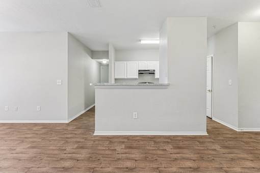 A kitchen area with a countertop and cabinets.