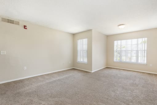Open Carpeted Room with Windows