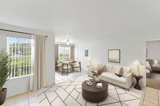 a living room with white walls and a white couch