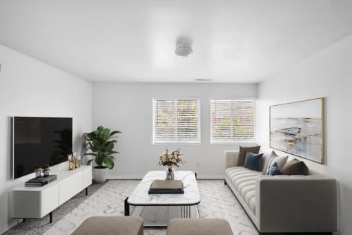 Virtually staged living room with couch, coffee table, lounge chairs, wall art, accent rug, television on tv stand, potted plant,  with carpet and white walls and two windows