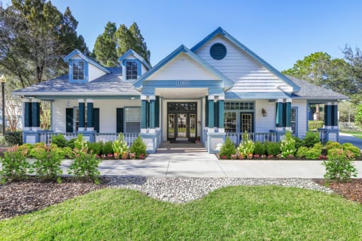leasing office with blue shutters and white siding