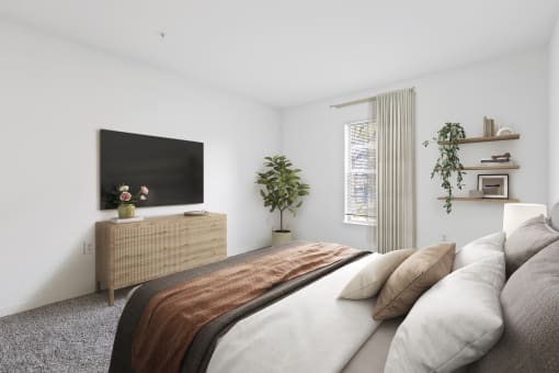a bedroom with a large bed and a flat screen tv
