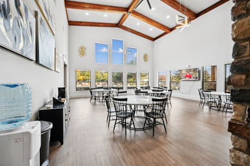 the preserve at ballantyne commons community room with tables and chairs