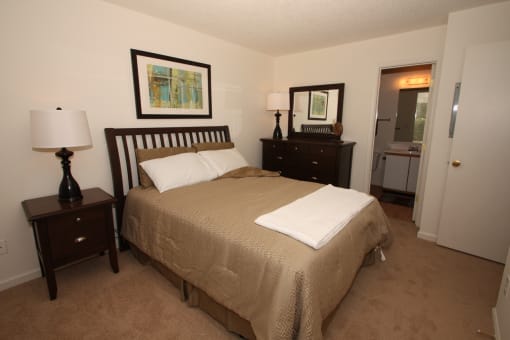 a bedroom with a bed and two night stands