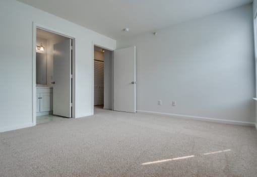 The master bedroom has wall to wall carpet, direct access to the bathroom and a large walk in closet.