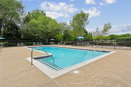 A rectangular pool with a slide in the middle.