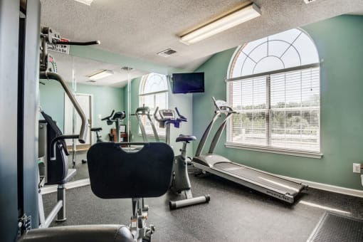 Bright Fitness Center with Windows and Exercise Equipment