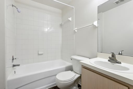 a bathroom with a sink toilet and a bath tub