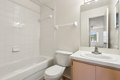 a bathroom with a sink toilet and a bath tub