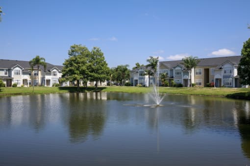 Waterfront View with Apartment Building Exterior and Trees