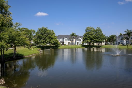 Waterfront View with Apartment Building Exterior and Trees