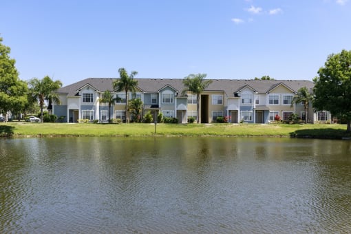 Waterfront View with Apartment Building Exterior and Trees