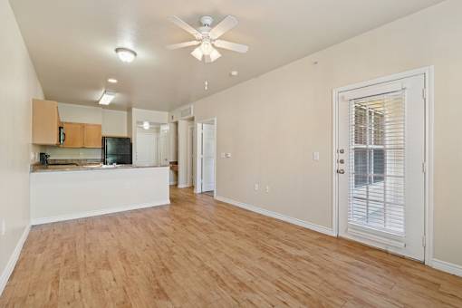 living room with hardwood-style flooring and ceiling fan