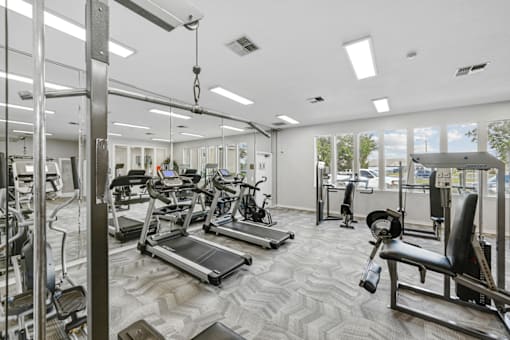 the gym at the enclave at woodbridge apartments in sugar land, tx