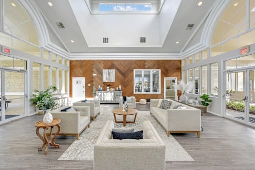 a living room filled with furniture and a large window