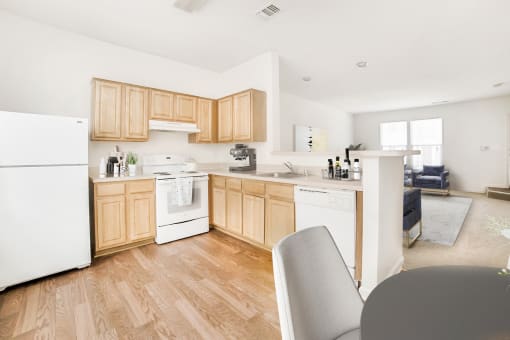 a kitchen with white appliances and wooden cabinets