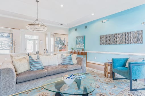 a living room filled with furniture and a large window