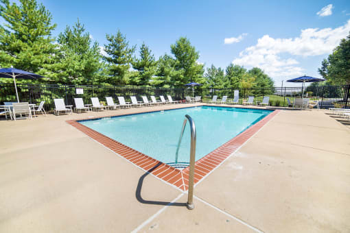 the reserve at bucklin hill pool with chaise lounge chairs and umbrellas