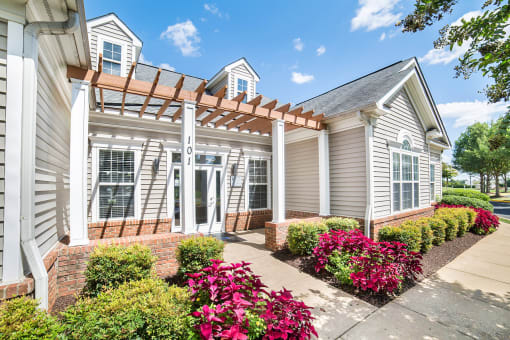 a house with a pergola in front of it