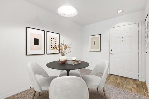 a dining room with a table and four chairs