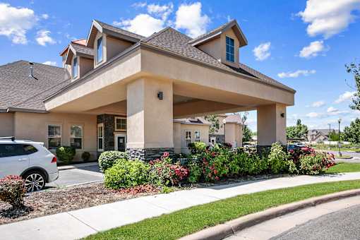 Community porte cochere with stone accent columns at Rose Cove Homes Apartments, Farmington, Utah
