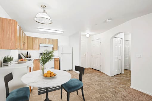 Dining area with round table and kitchen access at Rose Cove Homes Apartments, Utah, 84025